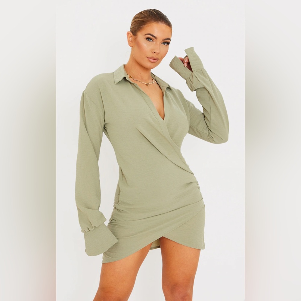 PrettyLittleThing Sage Green Textured Woven
Extreme Plunge Bell Cuff Shirt Dress